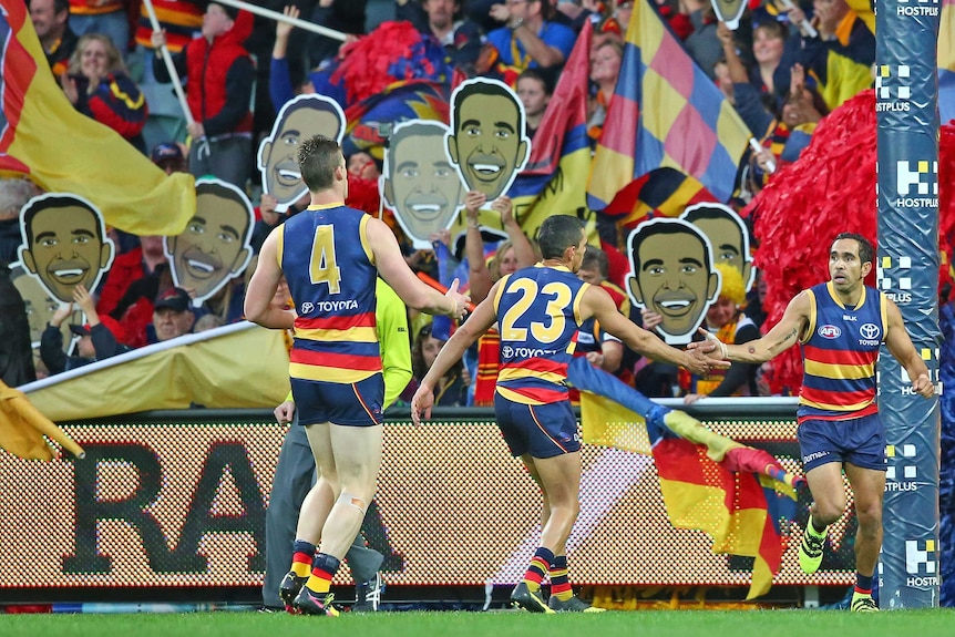 Eddie Betts celebrates in front of the Adelaide Crows fans