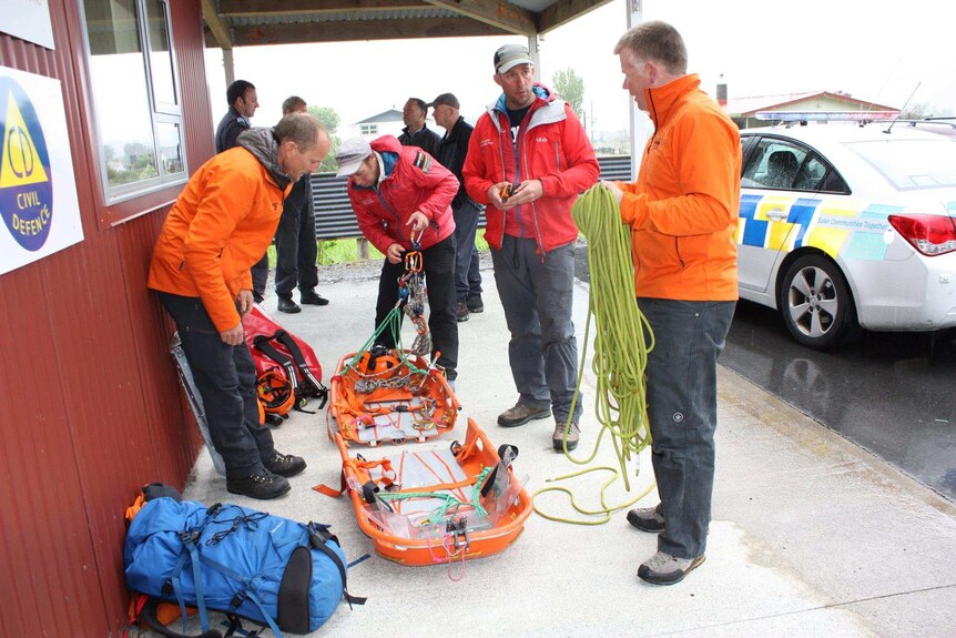 Fox Glacier rescue workers check equipment during poor weather conditions.