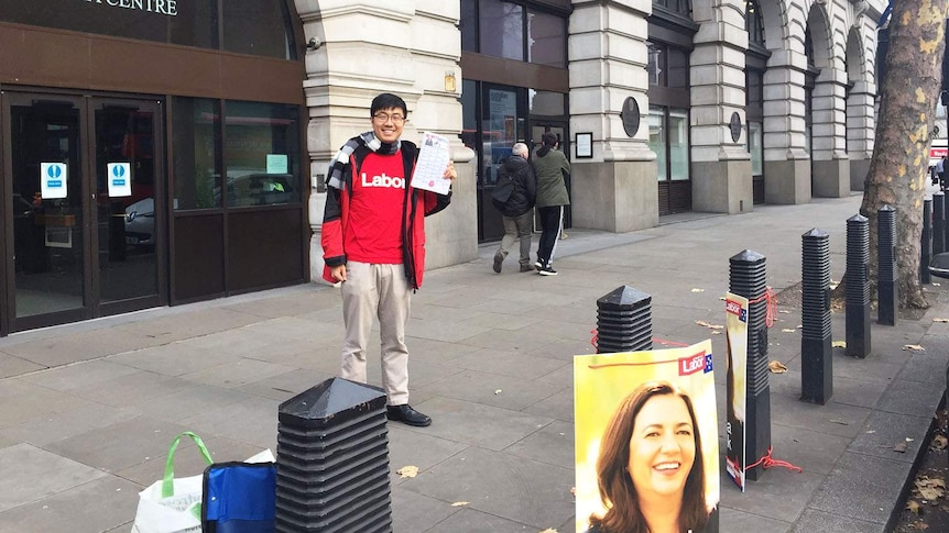 Labor supporter Jimmy hands out how-to-vote cards for ex-pats outside Australia Centre building in London.