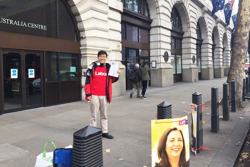 Labor supporter Jimmy hands out how-to-vote cards for ex-pats outside Australia Centre building in London.