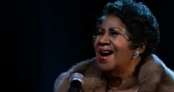 Aretha Franklin singing.