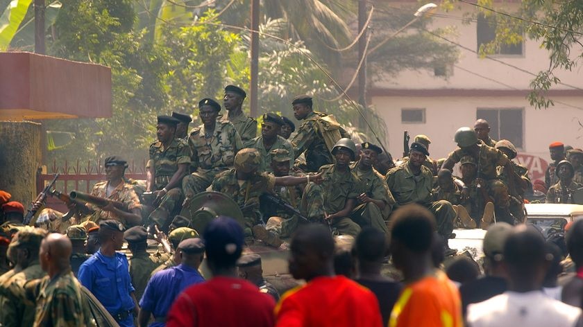 Several hundred soldiers have driven through Conakry in a show of strength.
