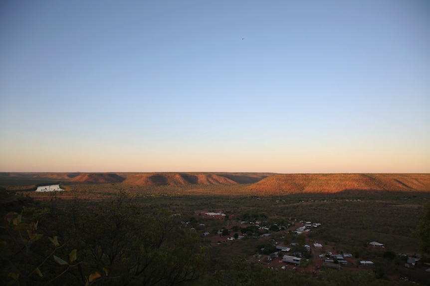 The small, north-west Northern Territory community of Timber Creek at sunset, seen from above.
