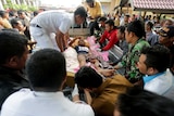 Injured man arrives at hospital after Aceh quake