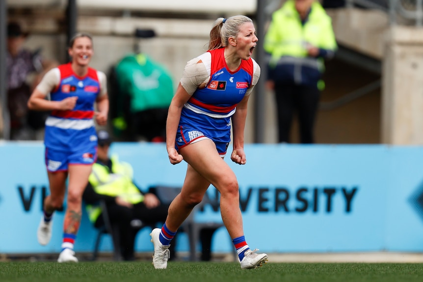 Gabby Newton screams with delight after kicking a goal