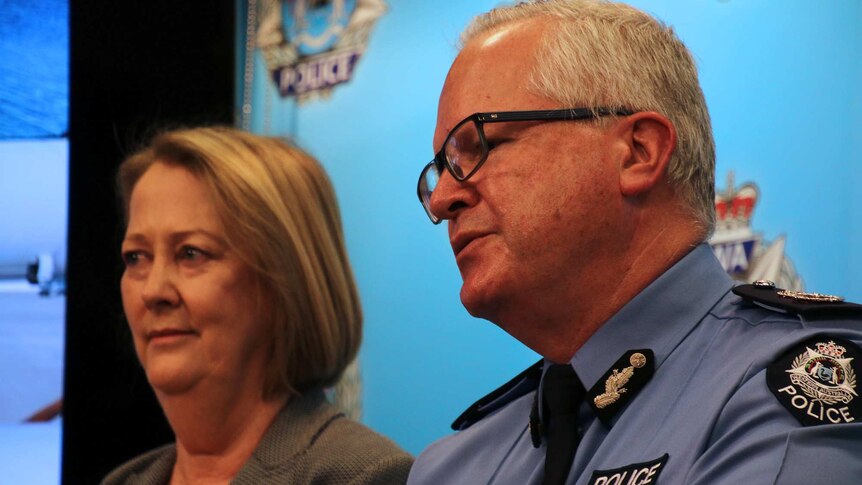 A tight head and shoulders shot of WA Police Commissioner Chris Dawson and Police Minister Michelle Roberts speaking.