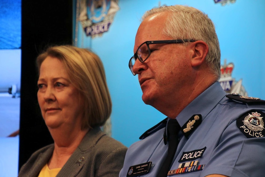 A tight head and shoulders shot of WA Police Commissioner Chris Dawson and Police Minister Michelle Roberts speaking.