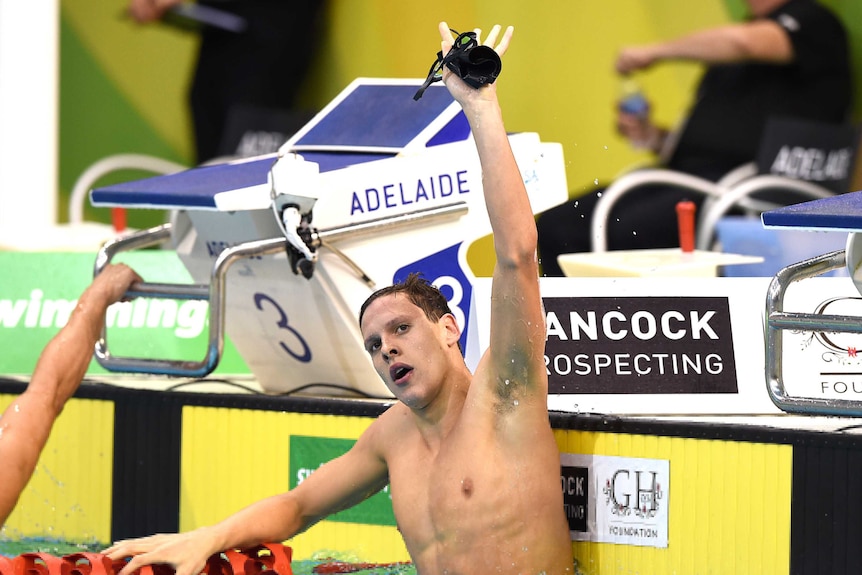 Mitch Larkin reacts after winning the Mens 100m Backstroke Final
