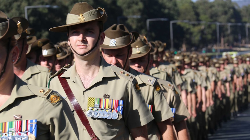 ADF personnel march along Anzac Parade