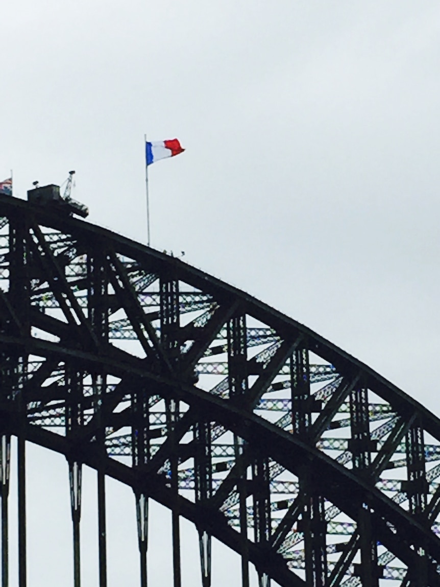 French flag flies over Sydney Harbour Bridge