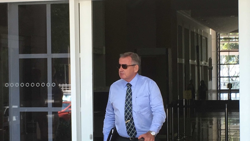Former corrections commissioner Ken Middlebrook walks out of the NT Supreme Court.