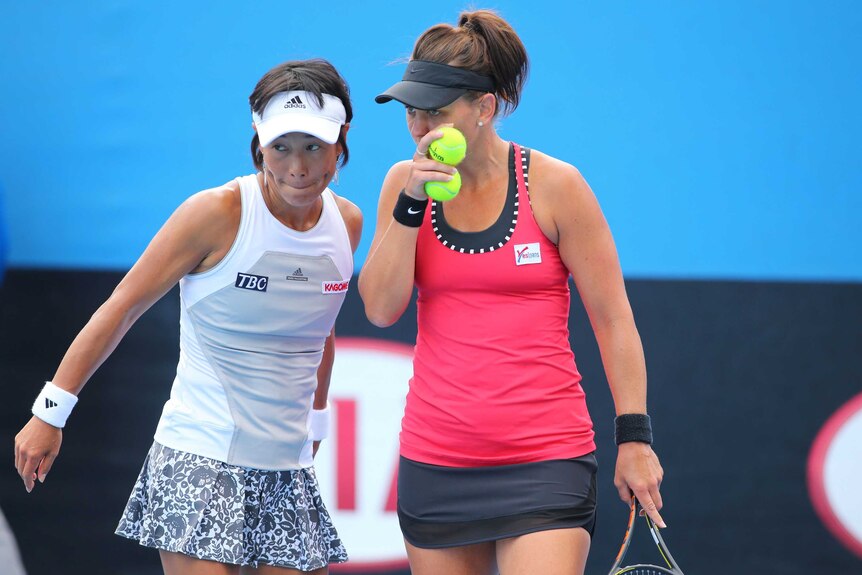 Japan's Kimiko Date-Krumm and Australia's Casey Dellacqua in their Australian Open doubles match.