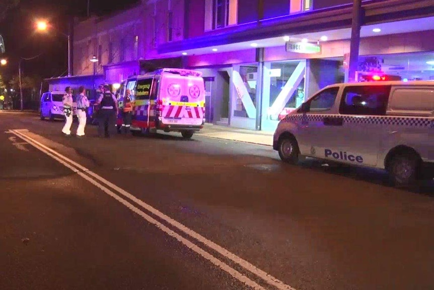 Police and paramedics outside a building