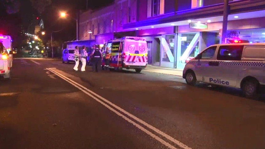 Police and paramedics outside a building