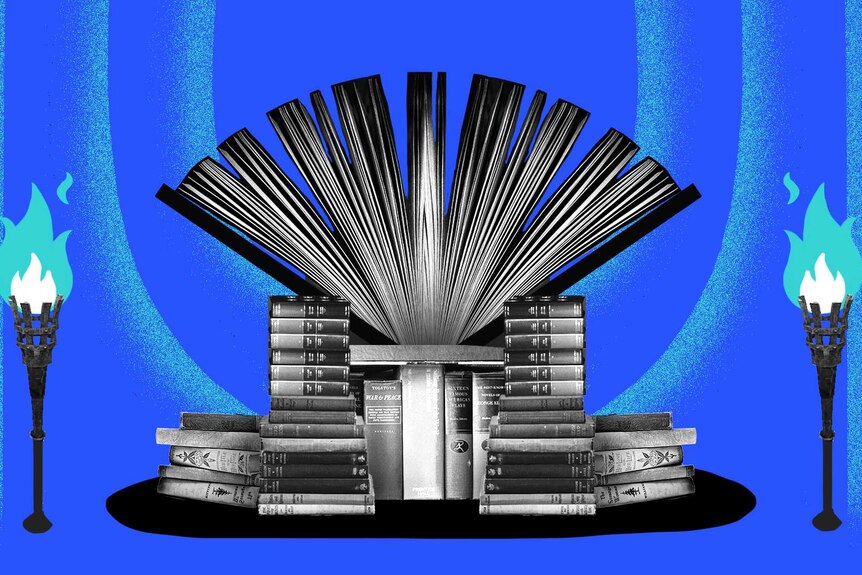 A throne made out of books surrounded by two fire torches with a blue background.