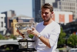 Stanislas Wawrinka poses with the Australian Open trophy