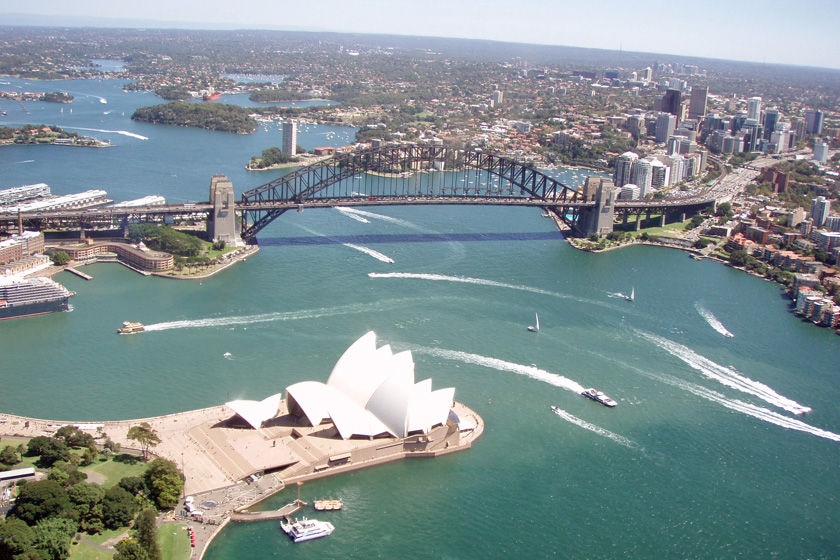 An aerial view of the Sydney Harbour Bridge and the Opera House