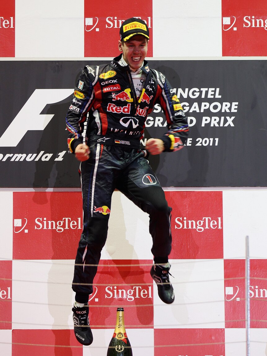 Jumping for joy ... back-to-back championships and Formula One history is within Vettel's grasp.