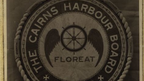 An aged photograph of The Cairns Harbour Board plaque.