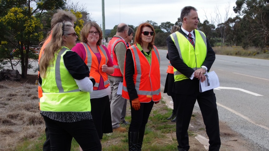 Acting road safety commissioner Kim Papalia (far right) with technical experts inspecting dangerous parts of the Great Eastern Highway