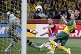 Mark Schwarzer makes a save for Australia in their fighting win against Serbia.