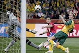 Mark Schwarzer makes a save for Australia in their fighting win against Serbia.