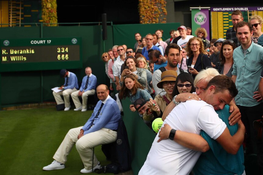 Marcus Willis hugs his mother after his first major win at Wimbledon