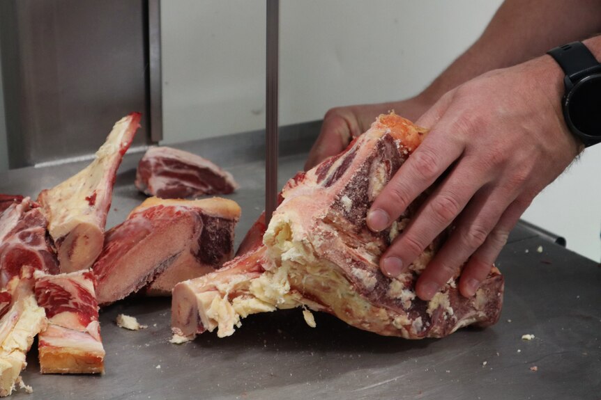 Close up image of lamb being butchered