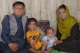 A photo of the Nazari family, with faces blurred to protect identities. 