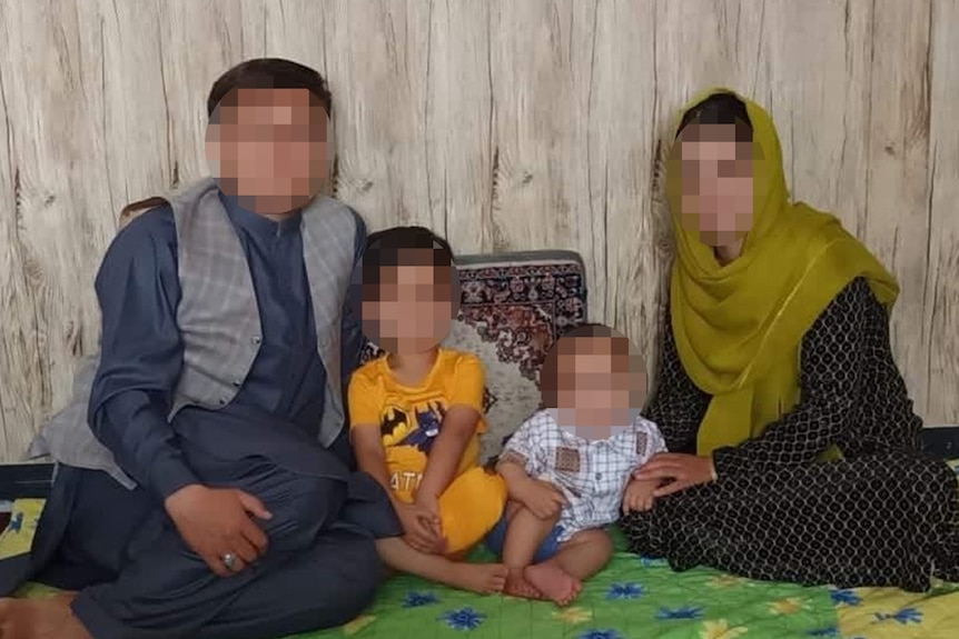 A photo of the Nazari family, with faces blurred to protect identities. 