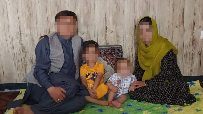 A photo of the Nazari family, with faces blurred to protect identities. 