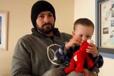 Josh Princi holding his young son Blayze