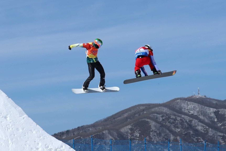 Jarryd Hughes in mid-air during his heat of the men's snowboard cross at the Olympic Winter Games.