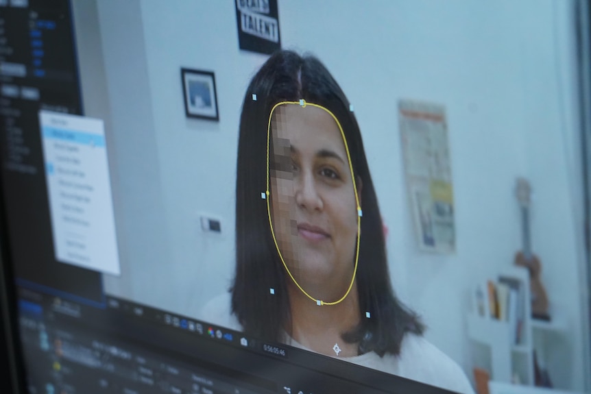 A close up of a woman's face being edited on a computer.