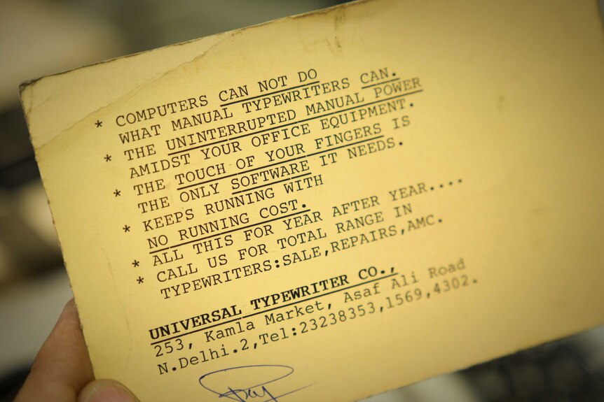 A card with a typed slogan, starting: Computers can not do what manual typewriters can.
