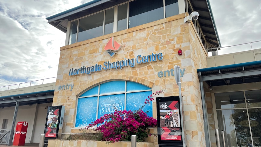 A tall limestone building with Northgate Shopping Centre signage in blue on the front.