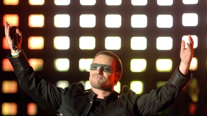 U2 frontman Bono reacts to the crowd