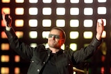 U2 frontman Bono reacts to the crowd