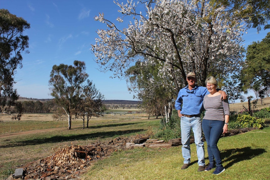 Fire-affected property owners Kathy and Saxon McGregor standing in their garden