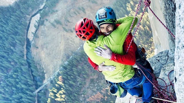 Climbers Tommy Caldwell and Kevin Jorgeson hug after Yosemite climb