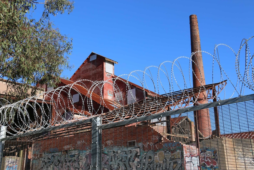 A razor wire fence around the old brickworks that was built near Surrey Dive.
