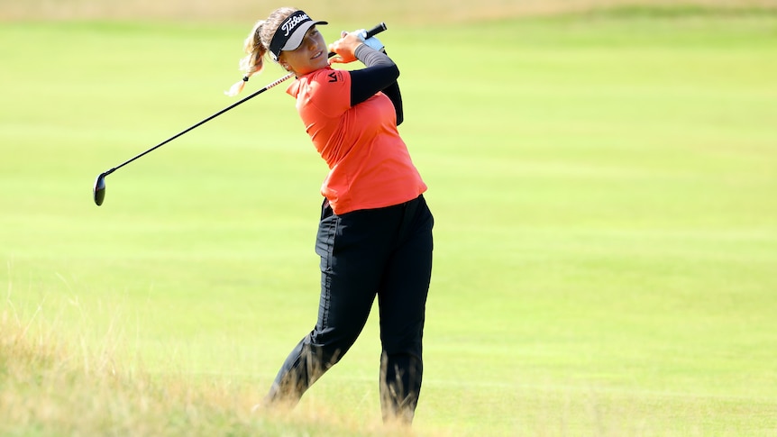Australian golfer Steph Kyriacou in the action of hitting a ball while playing a golf tournament