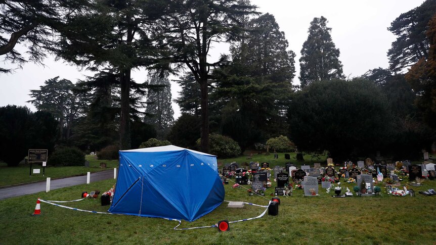 A tent used by police forensic investigators covers the grave of Alexander Skripal.