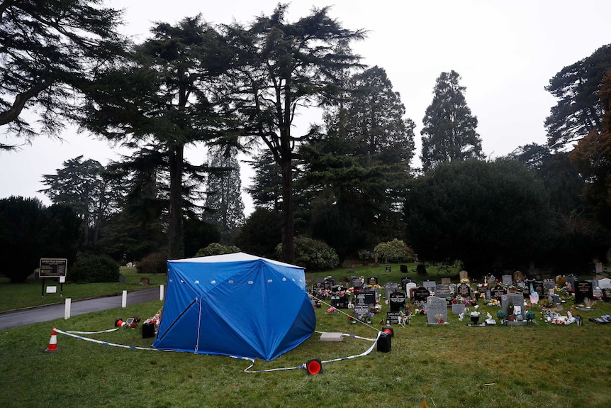 A tent used by police forensic investigators covers the grave of Alexander Skripal.