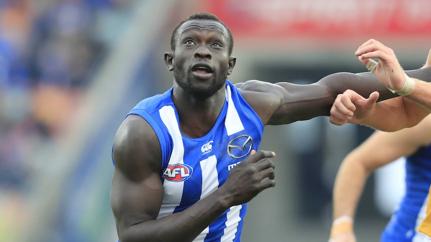 Majak Daw eyes the ball while on the field.
