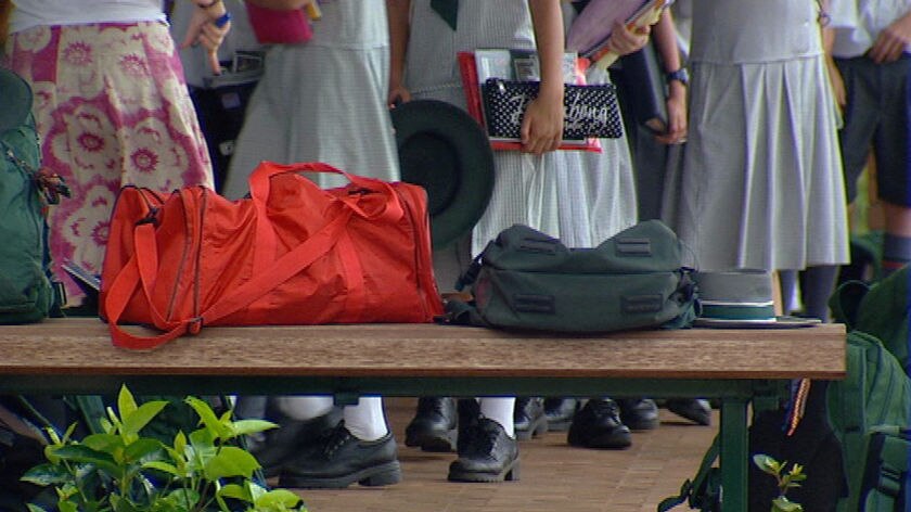 TV still of school kids carrying books with bags. (ABC TV News: file photo)