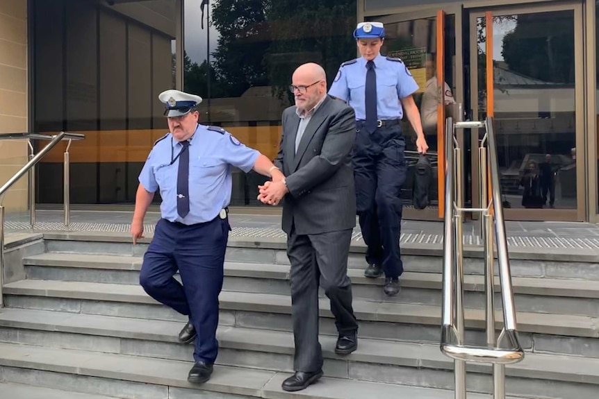 Darrel George Harington in handcuffs.