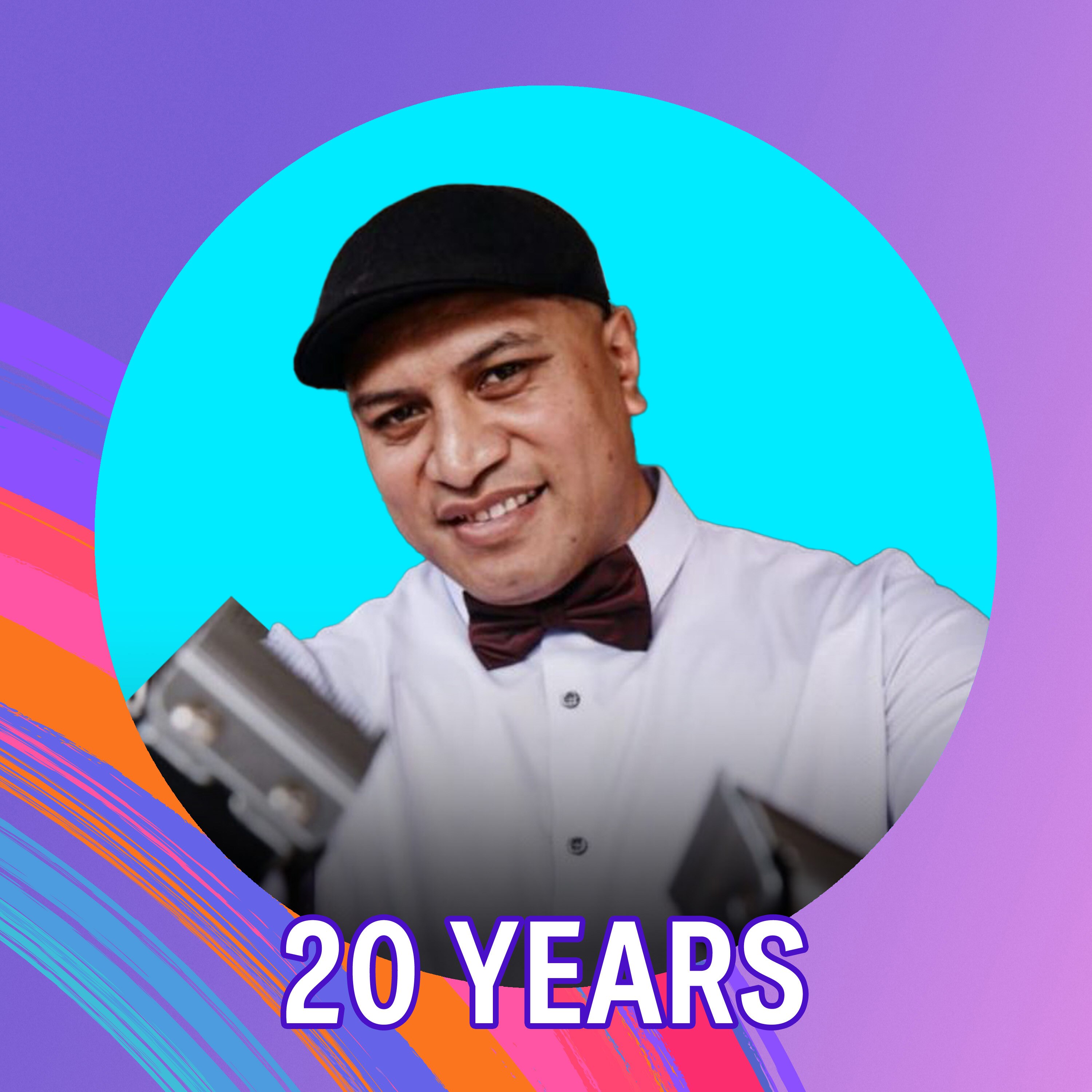 A man with a black cap smiles.