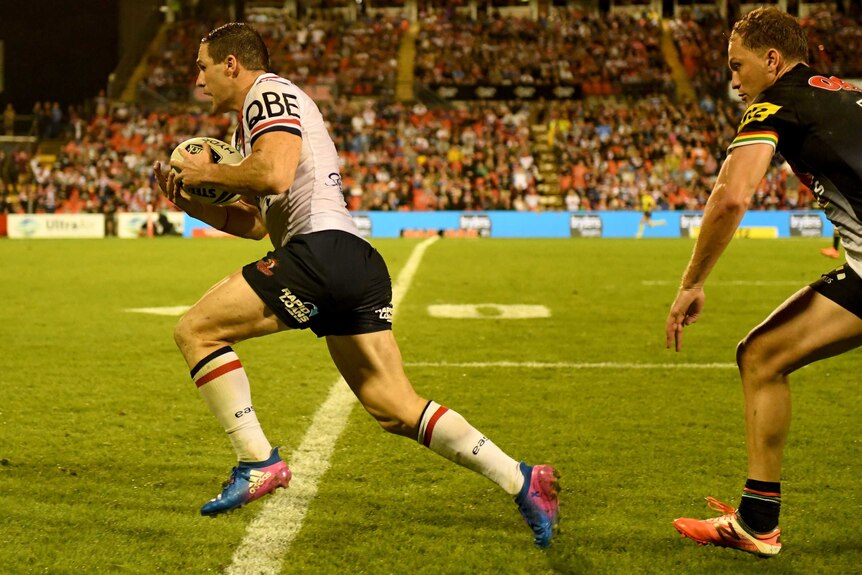 Sydney Roosters' Michael Gordon breaks away to score a try against Penrith Panthers