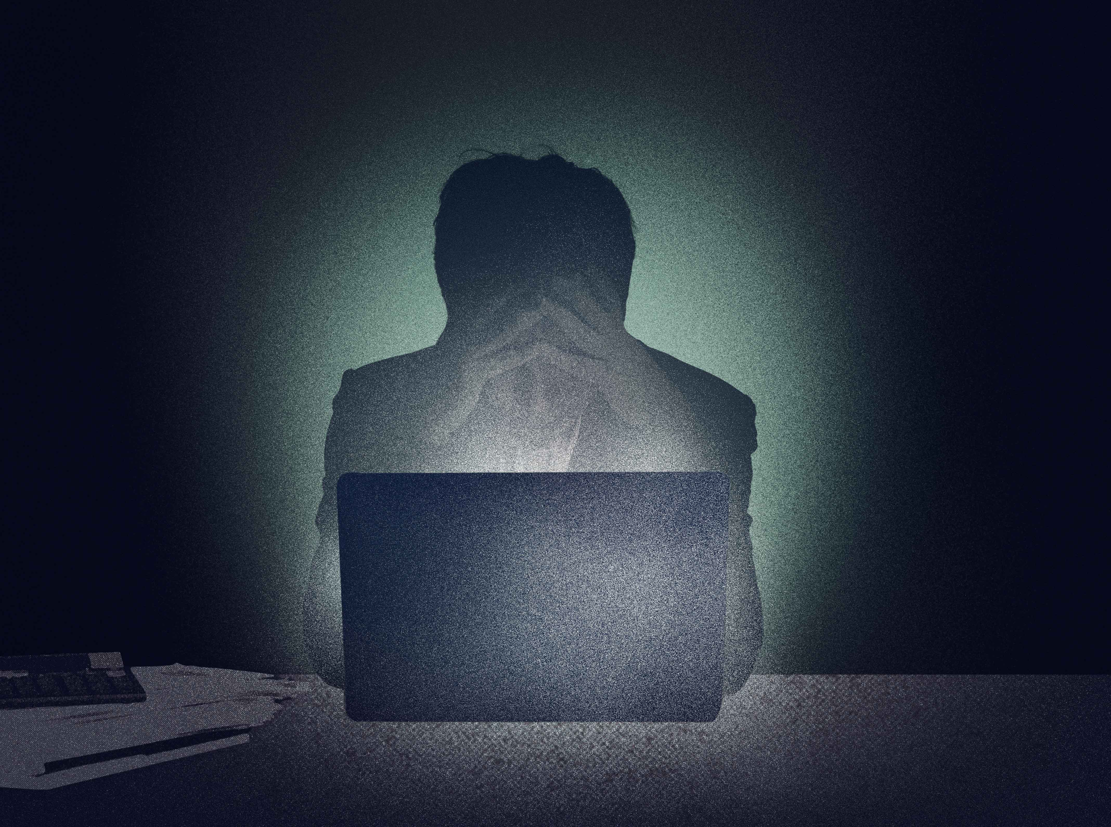 An illustration of a stressed man with both hands raised to forehead sitting at desk in front of a laptop in a dark room.